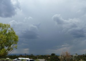 Rain arrives in monsoon season, seen from Museum Hill near Santa Fe, NM